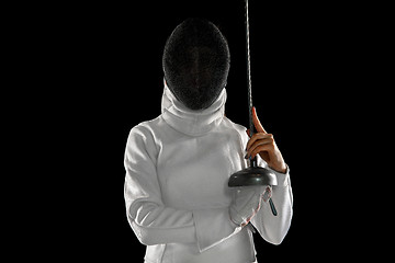 Image showing Teen girl in fencing costume with sword in hand isolated on black background