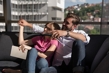 Image showing Young couple watching television