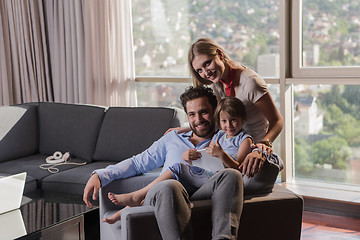 Image showing happy young couple spending time with kids