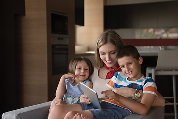 Image showing happy young mother spending time with kids