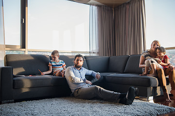 Image showing Happy Young Family Playing Together on sofa