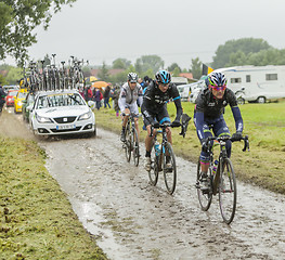 Image showing Group of Cyclists on a Cobblestone Road - Tour de France 2014