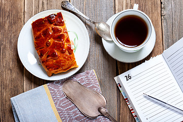 Image showing Tea, cake and diary. Still life