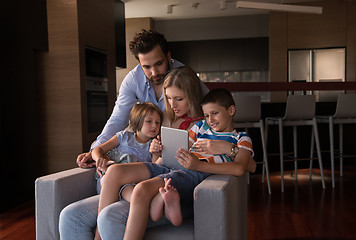 Image showing happy young couple spending time with kids