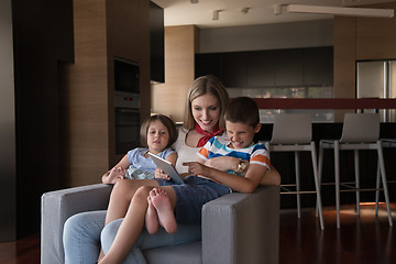 Image showing happy young mother spending time with kids