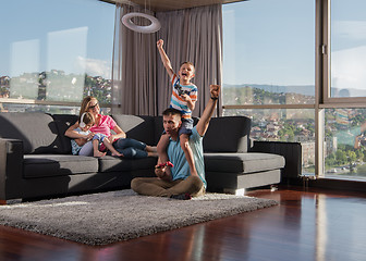 Image showing Happy family playing a video game