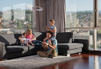 Image showing Happy family playing a video game