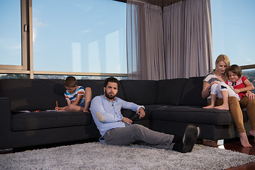 Image showing Happy Young Family Playing Together on sofa