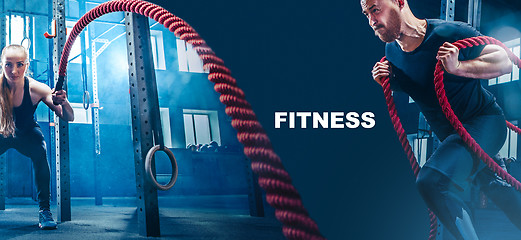 Image showing Men with battle rope battle ropes exercise in the fitness gym.