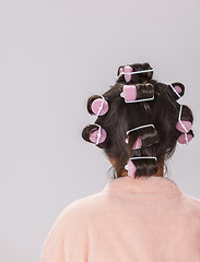 Image showing Woman with Curlers