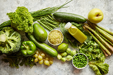 Image showing Green antioxidant organic vegetables, fruits and herbs placed on gray stone