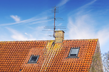 Image showing Rooftop with an antenna and a chimney