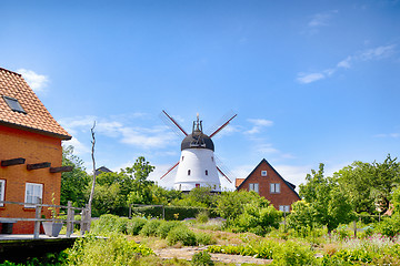 Image showing Old mill in a green garden in the summertime