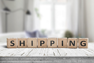 Image showing Shipping sign on a wooden desk