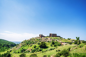 Image showing Ruin of a castle on the top af o green hill