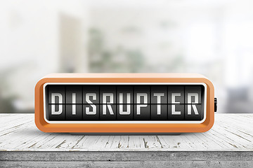 Image showing Disrupter alarm on a wooden table in a bright room