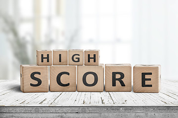 Image showing High score sign on a table in a bright home