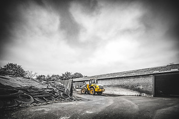 Image showing Yellow excavator at a construction site