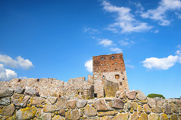 Image showing Castle ruin rising up behind an old brick wall