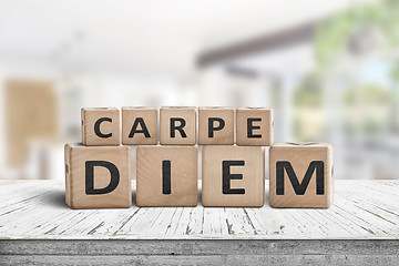 Image showing Carpe diem seize the day sign on a table