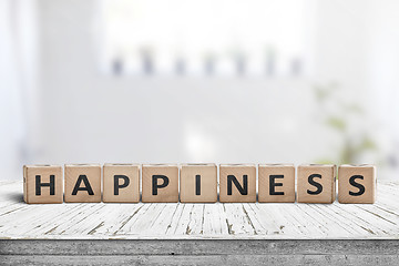 Image showing Happiness sign made of wood in a bright living room