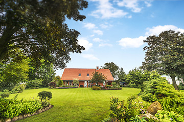 Image showing Red brick house in a beautiful garden