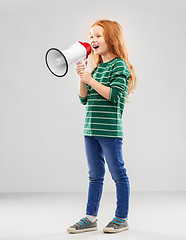 Image showing smiling red haired girl speaking to megaphone