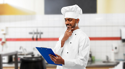 Image showing indian chef with clipboard at restaurant kitchen