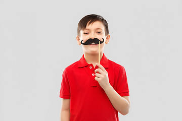 Image showing smiling boy in red t-shirt with black moustaches