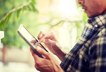 Image showing close up of man with tablet pc