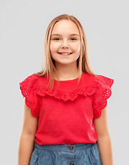 Image showing beautiful smiling girl in red shirt and skirt