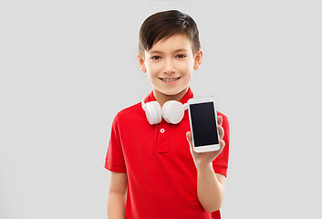 Image showing boy with headphones showing smartphone