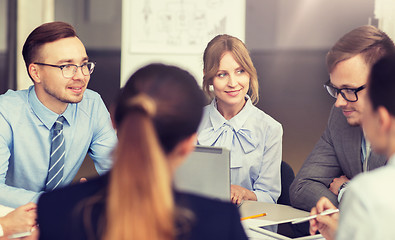 Image showing smiling business people meeting in office