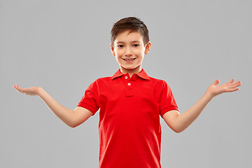 Image showing smiling boy holding something on empty hands