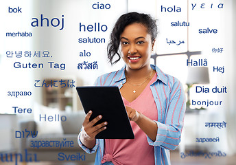 Image showing happy african american woman using tablet pc