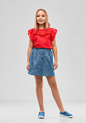 Image showing beautiful smiling girl in red shirt and skirt