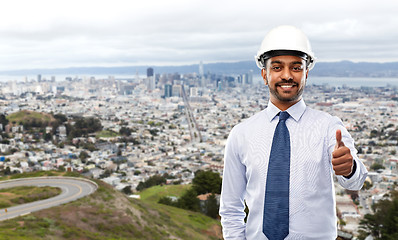 Image showing architect or businessman in helmet shows thumbs up