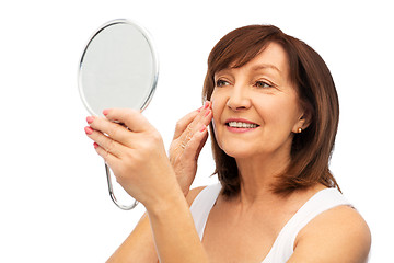 Image showing portrait of smiling senior woman with mirror