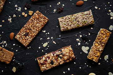 Image showing Homemade gluten free granola bars with mixed nuts, seeds, dried fruits