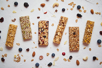 Image showing Homemade gluten free granola bars with mixed nuts, seeds, dried fruits