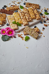 Image showing Various kinds of protein granola bars with dry fruits and berries