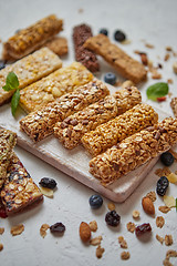 Image showing Homemade gluten free granola bars with mixed nuts, seeds, dried fruits