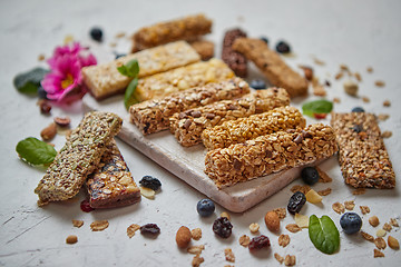 Image showing Various kinds of protein granola bars with dry fruits and berries