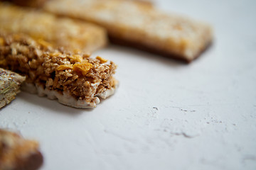 Image showing Close up on healthy granola fit bars arragement. Placed on white table