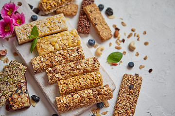 Image showing Various kinds of protein granola bars with dry fruits and berries