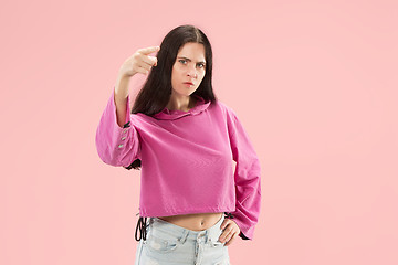 Image showing The overbearing business woman point you and want you, half length closeup portrait on pink background.