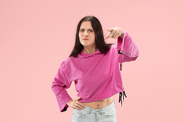 Image showing The overbearing business woman point you and want you, half length closeup portrait on pink background.