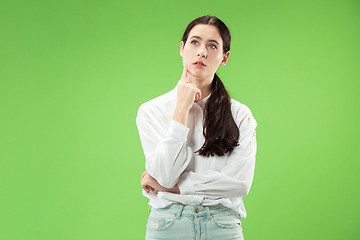 Image showing Young serious thoughtful business woman. Doubt concept.