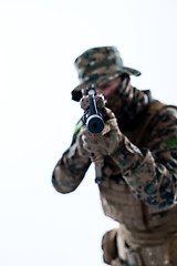 Image showing soldier in action aiming laseer sight optics