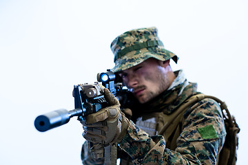 Image showing soldier in action aiming laseer sight optics